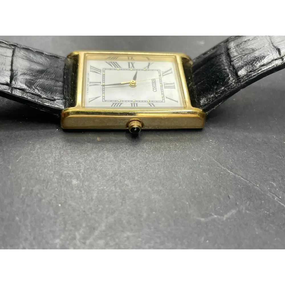 Seiko 7N01-0EZ0 Tank Rectangle Gold Tone Quartz Watch Black Leather Band 25MM